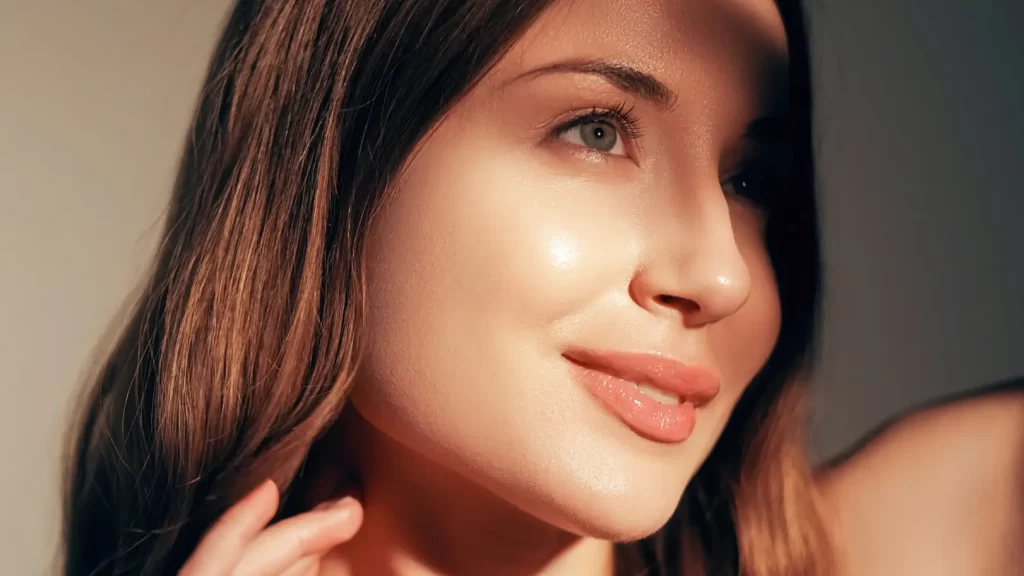 Woman with glowing skin in warm natural light